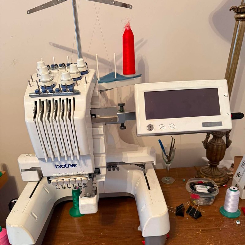 Brother six-needle machine with its touch screen and thread stand