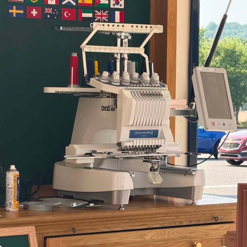 Brother Entrepreneur Pro X with its touch screen beside a window