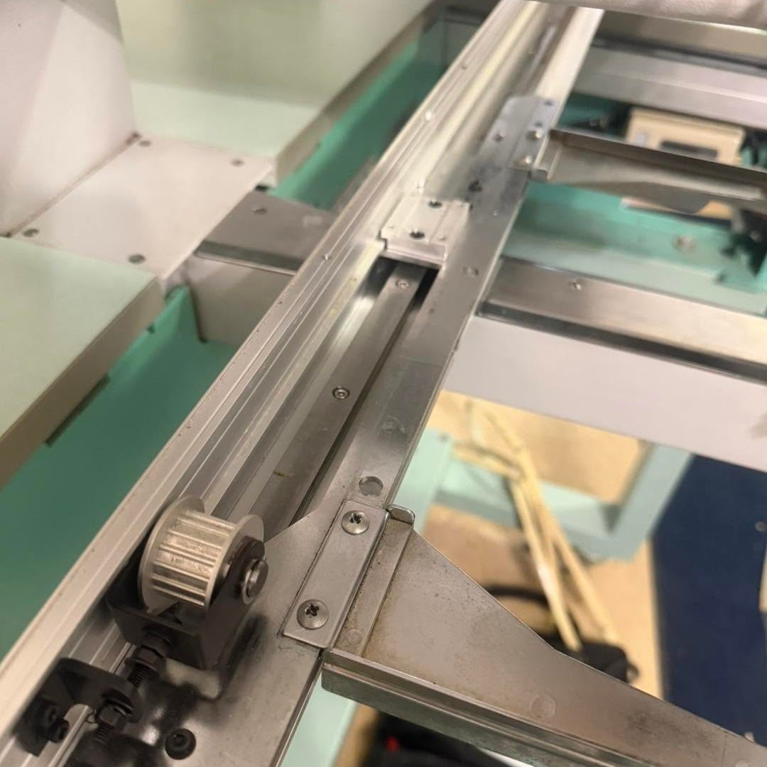 Pulley and rail of an embroidery machine frame drive