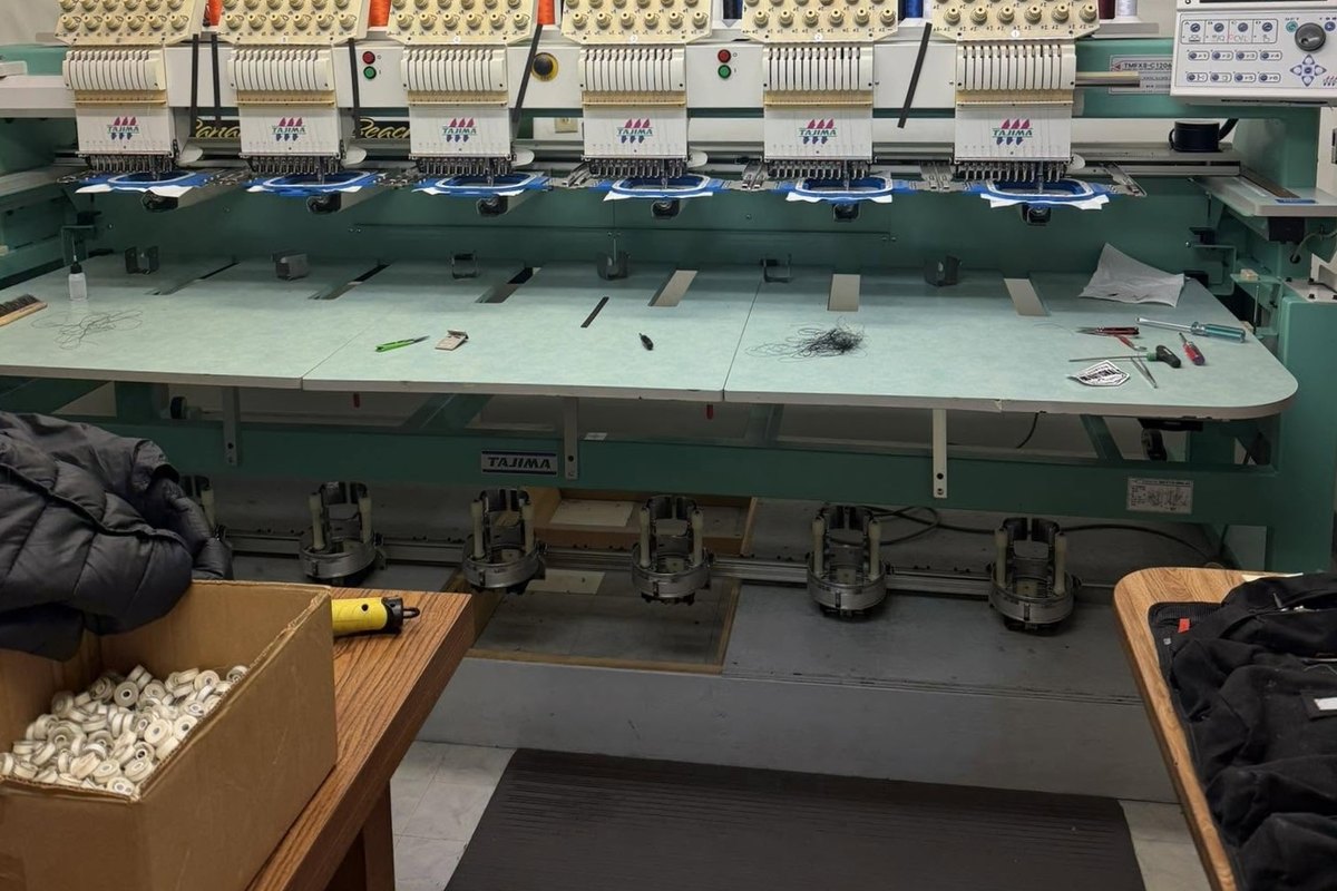Six-head Tajima embroidery machine with a hoop loaded at each head